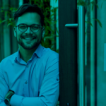 business owner stand beside his business shop door, Open Sign on the door