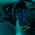 unberdriver looking in his phone for the direction in google maps
