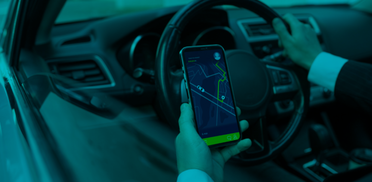 unberdriver looking in his phone for the direction in google maps