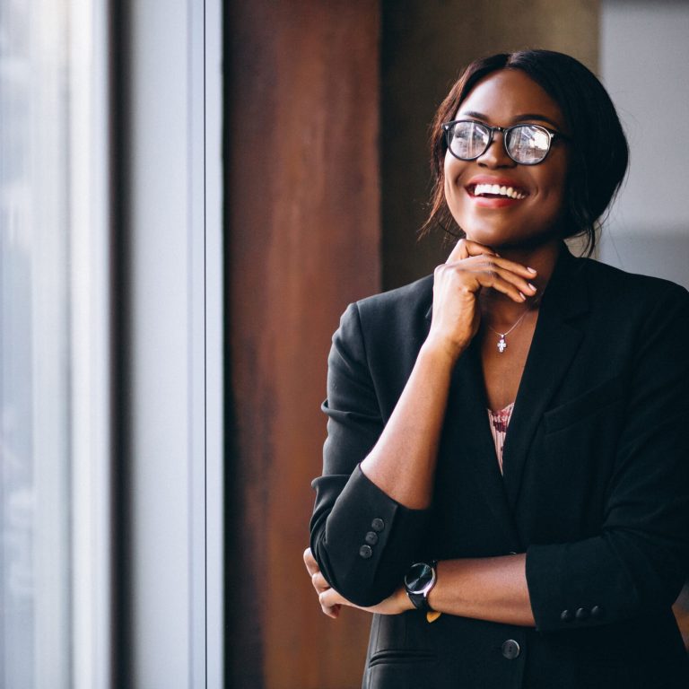 African american business woman by the window